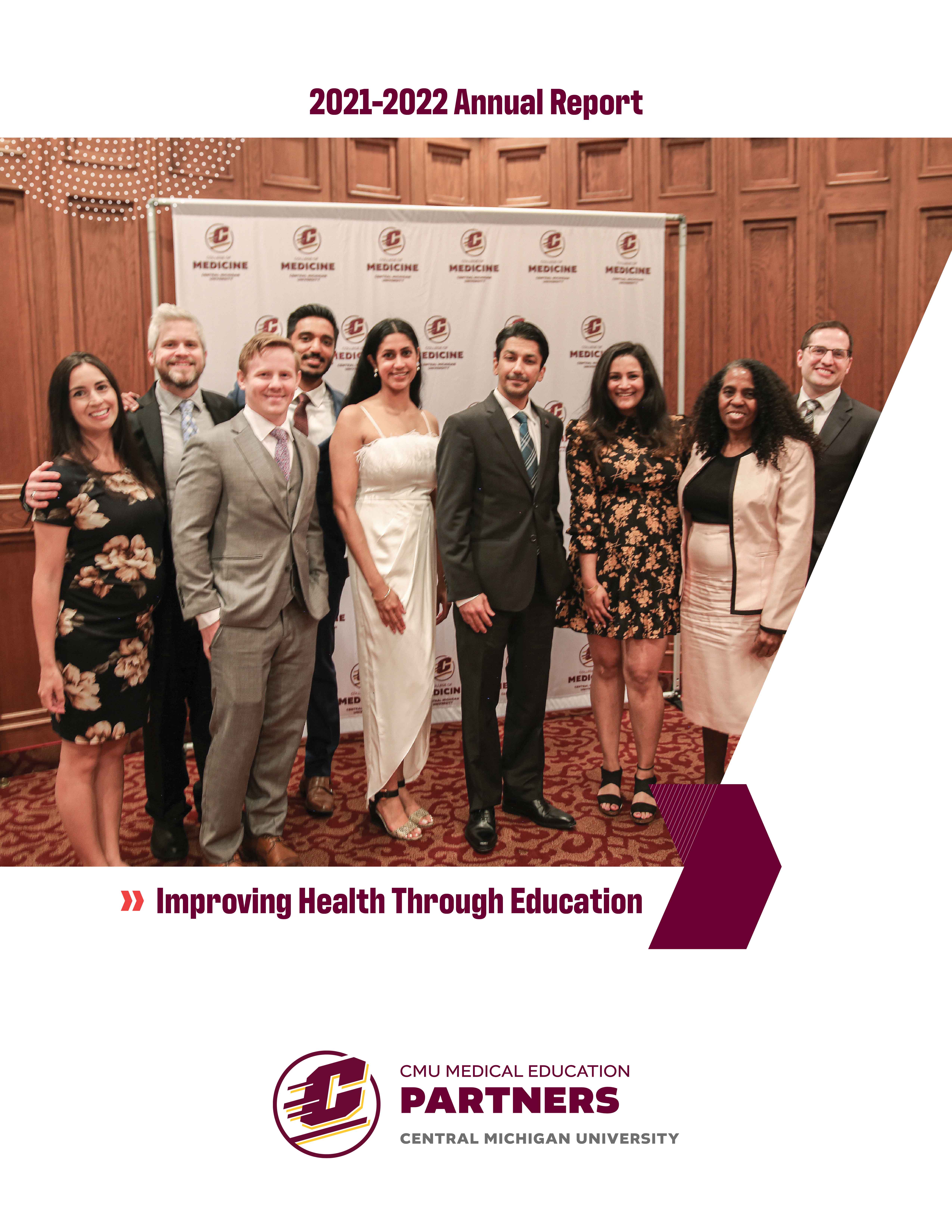 Residents and faculty smiling for photo at resident recognition ceremony.
