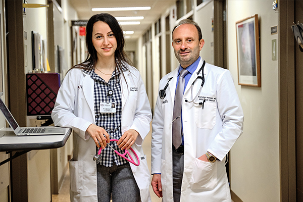 Image of medical staff standing in the hallway.